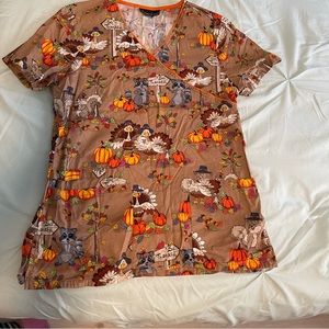 Cherokee scrub top. Size small. Thanksgiving design raccoons turkeys